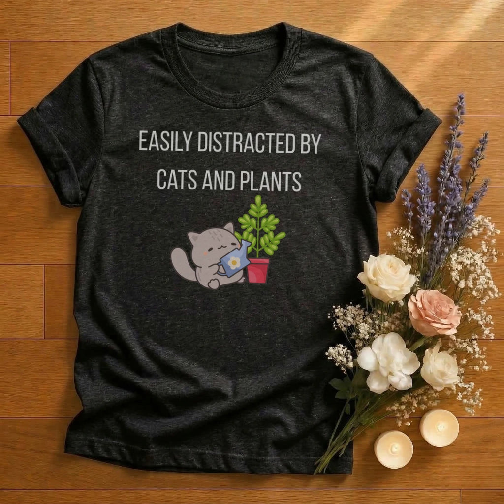 https://wescale-cdn.com/generated-mockups/666ffdf4-3d69-46d2-92d6-f61d0e656fc2/ccf916bf-38f3-4a62-a2bd-96643d4f447d/ca09d525-eaa6-4789-85bb-9316ec0543c5_designs/easily_distracted_by_cats_and_plants_graphic_white_1774639596262_9xzmm7.png_1774639601525.webp