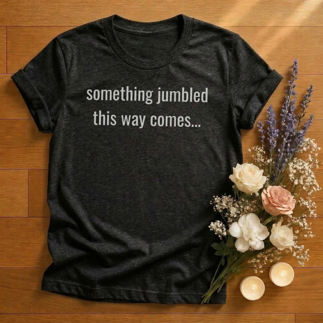 https://wescale-cdn.com/generated-mockups/666ffdf4-3d69-46d2-92d6-f61d0e656fc2/a704c257-bf38-4bfa-b8c6-19ae13e19670/ca09d525-eaa6-4789-85bb-9316ec0543c5_designs/something_jumbled_this_way_comes_white_1775153298818_amnz6w.png_1775153301840.webp